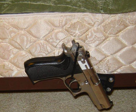 gun magnet + pistol on bedframe