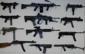 automatic rifles mounted on the wall