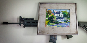 hide gun behind painting