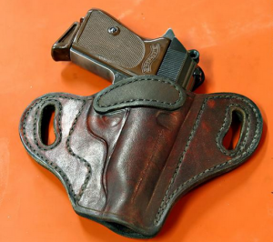 gun in holster on table